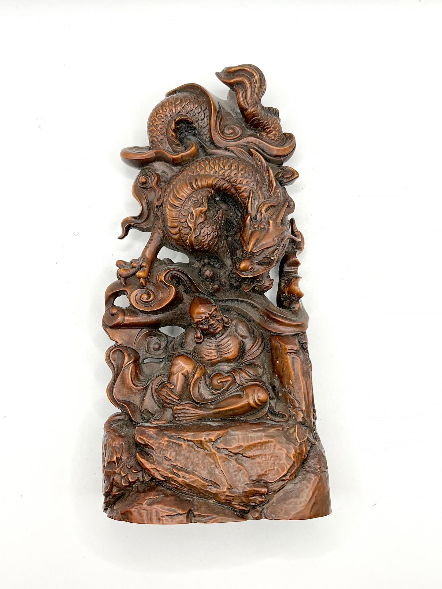 The wood carving of Arhat subduing the dragon