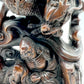The wood carving of Arhat subduing the dragon