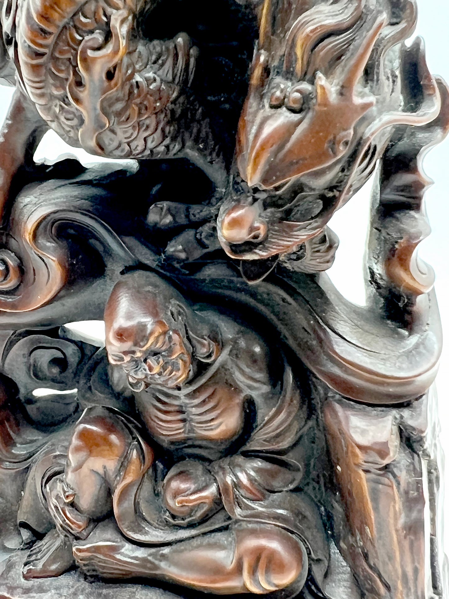The wood carving of Arhat subduing the dragon